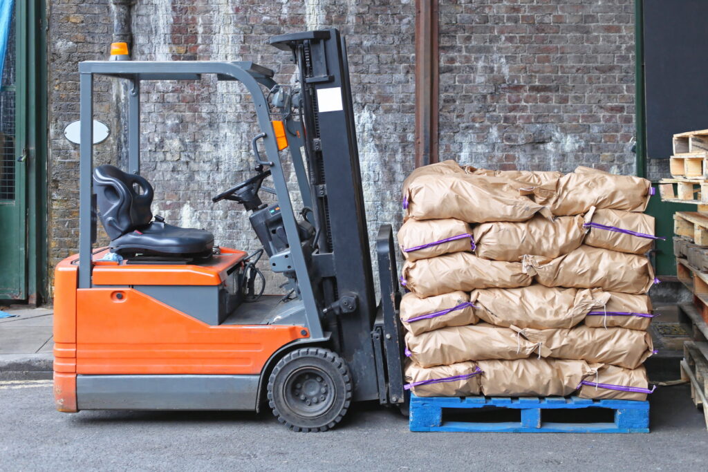 Forklift With Potato Sacks at Pallet